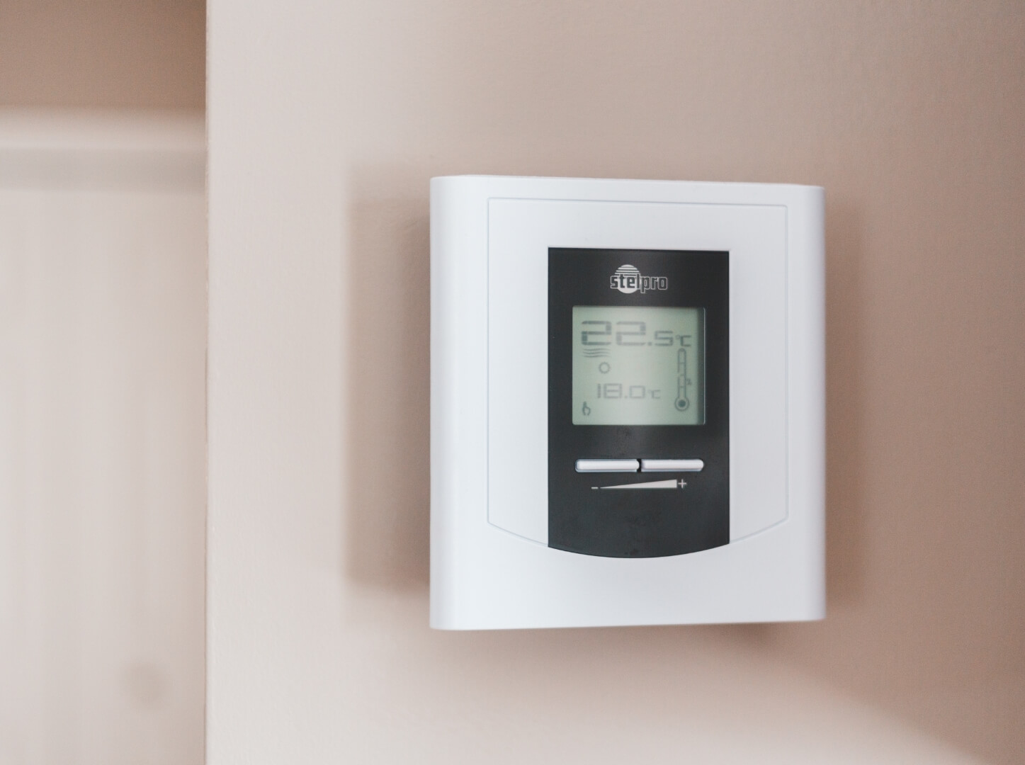 Digital thermostat showing temperature settings, important for understanding EPC meaning.